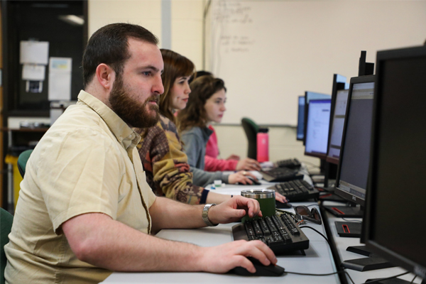 Row of students using computers.