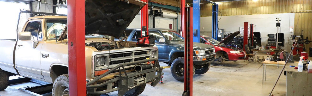 Student working on a car