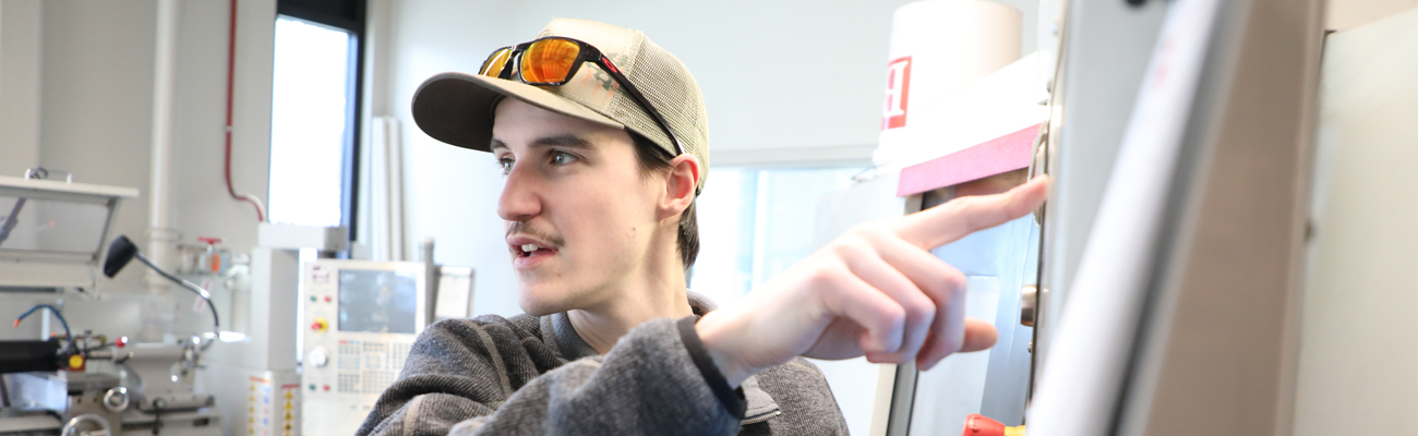 Student showing results on a lab machine