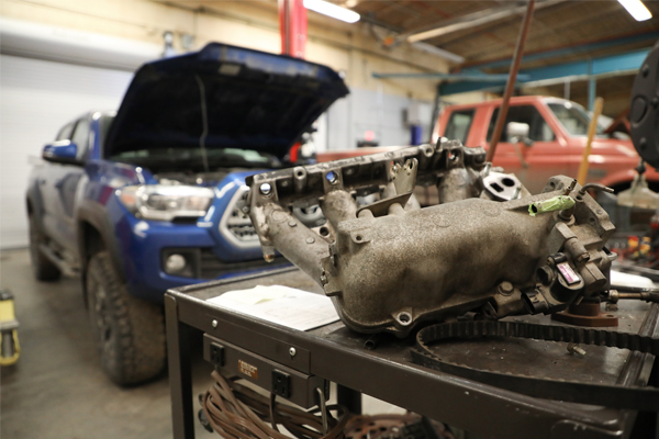 Intake manifold and trucks in a garage