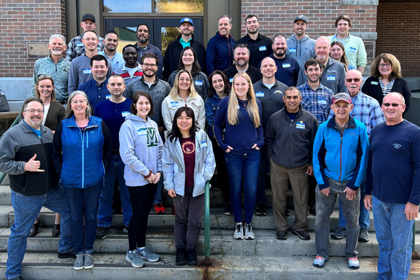 Industrial Hygiene students and faculty in front of a building.