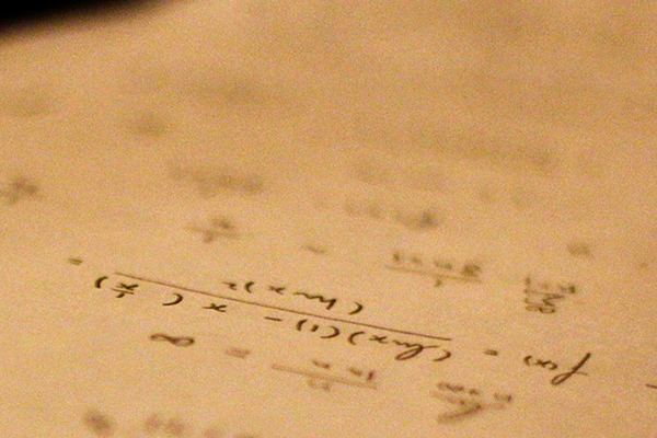 Math equations written on a piece of paper