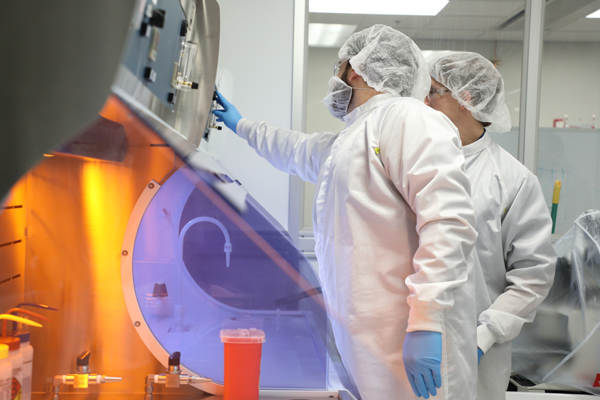 Two people using equipment in a nano-technology lab