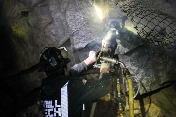 Man drilling in an underground mine