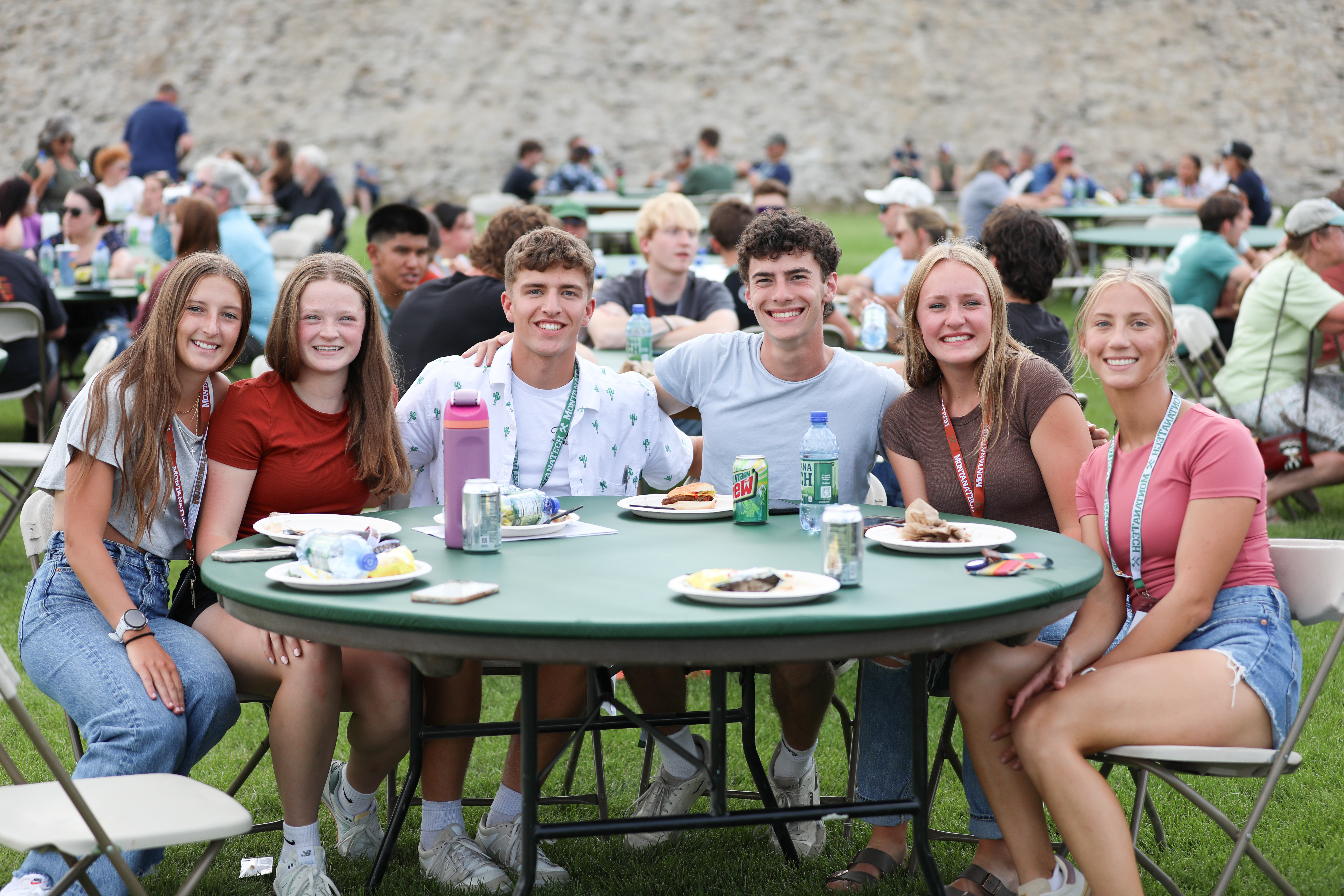 Group of students sitting together at a round table 