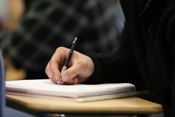 Student taking notes.