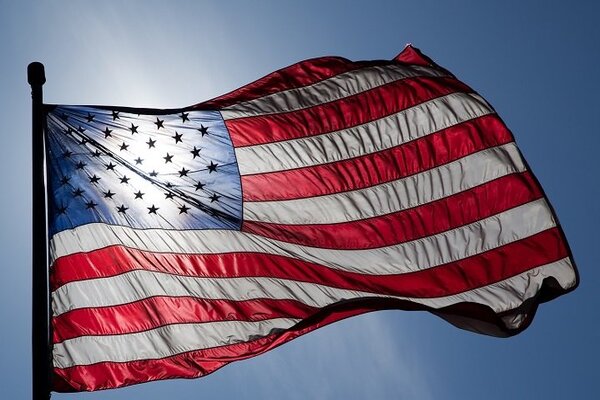 The American flag waving in the sun