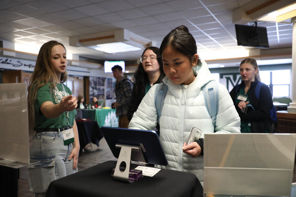 Staff directing students at Career Fair.