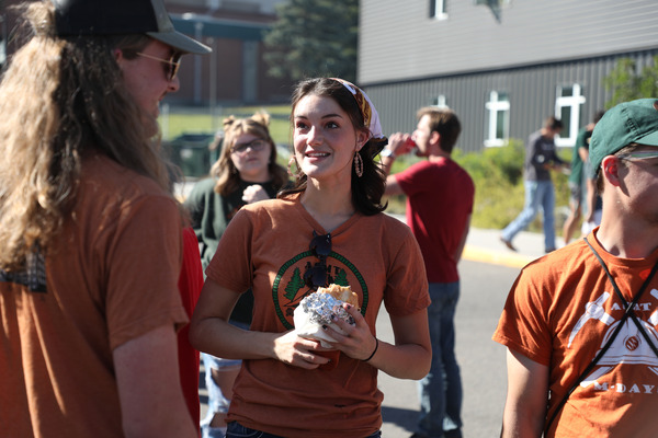 Students at a campus tailgate.