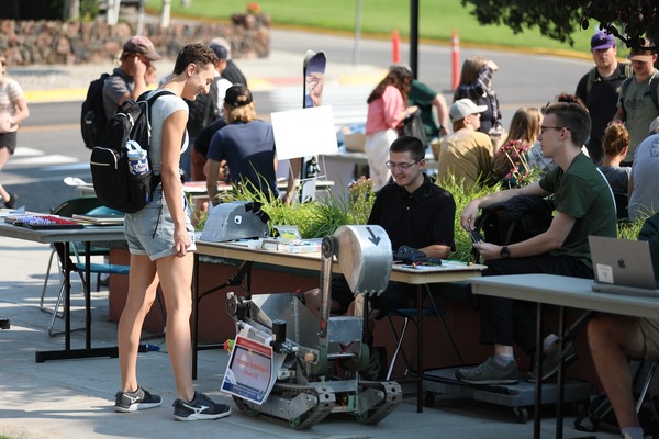 Students show off their robot at Club Rush.