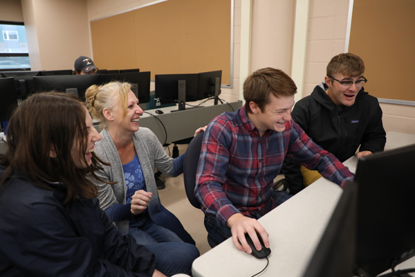 Staff helping students.