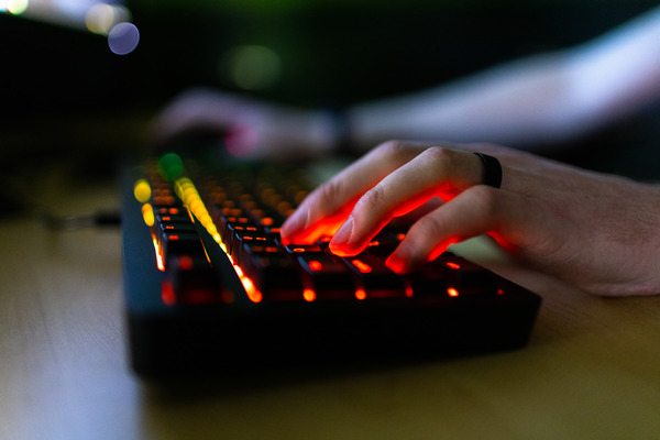 Student typing on keyboard.