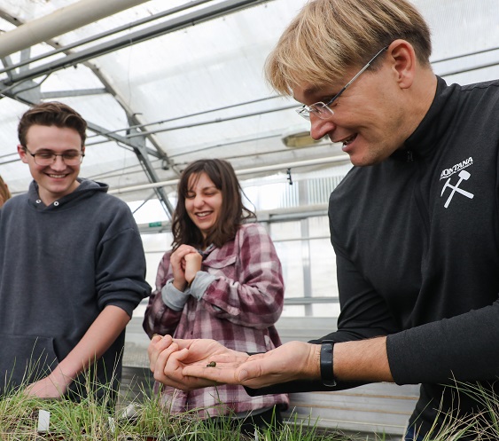 Professor Robert Pal teaching in a greenhouse