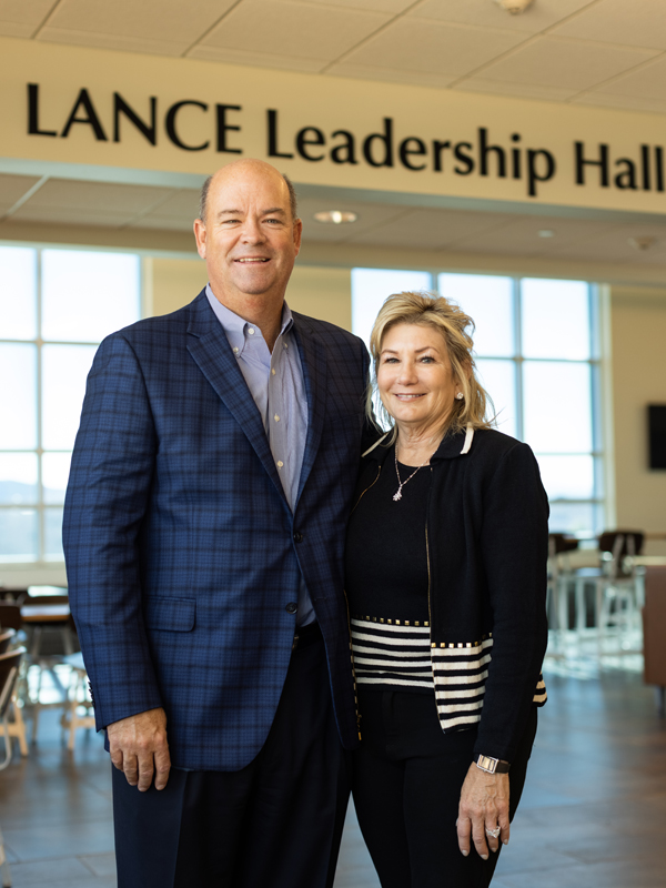 Ryan and Lisa Lance in front of the Lance Leadership Hall