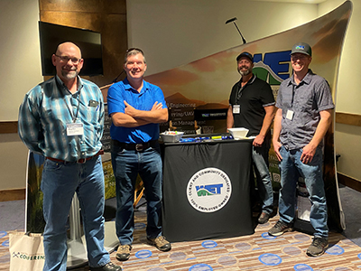 (L-R) Martin Carlson of CDM Smith enjoys visiting with Josh Vincent, Steve Anderson, and Stephen Frazee of WET.