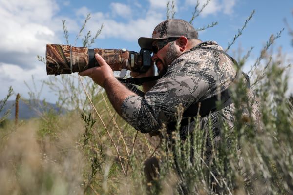 !Shawn Moorman working with his camera in the field