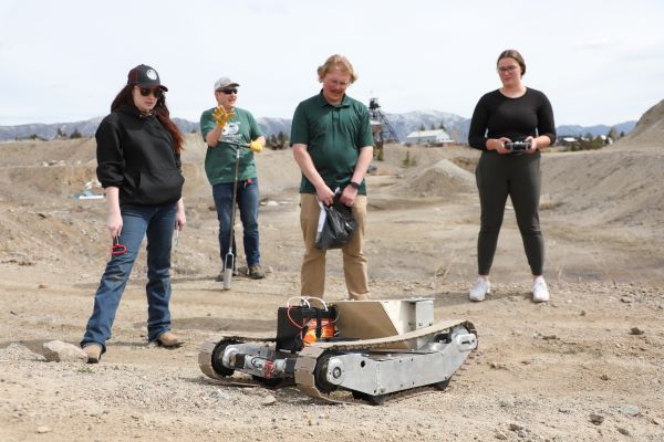 !Students with a ground drone