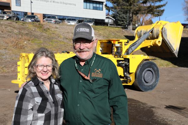 Scott and Sonya pose with loader 