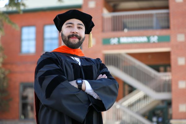 Amirhosein Riahi in cap and gown