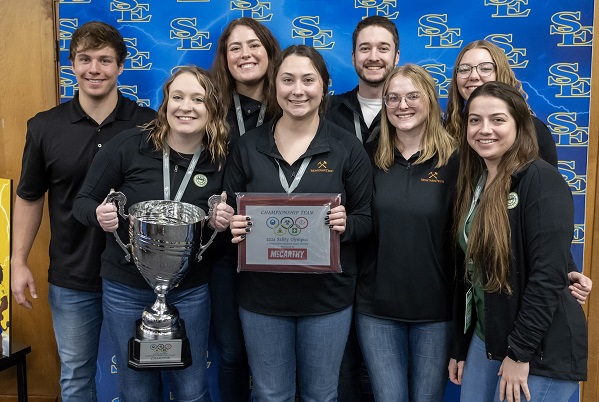 Safety Olympics team photo with trophy