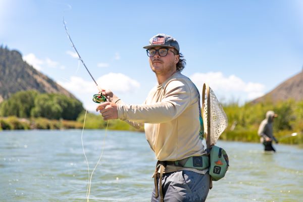 A student casts a fly line