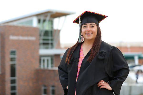 !Rylee Mitchell in a beaded cap and gown
