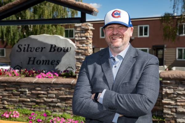 !Dr. Richard LaDouceur stands in front of Silver Bow homes