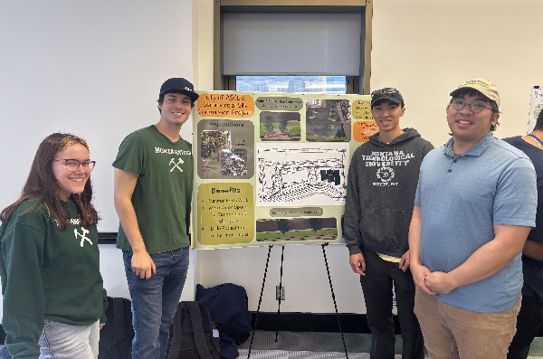 !Four Montana Tech students display their project poster