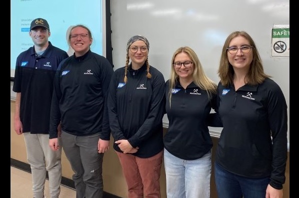 !Five students in Montana Tech hoodies pose for a photo
