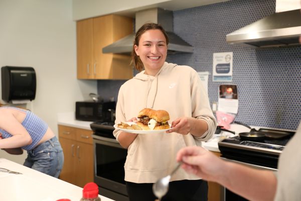 !A student poses with her Hawaiian sliders