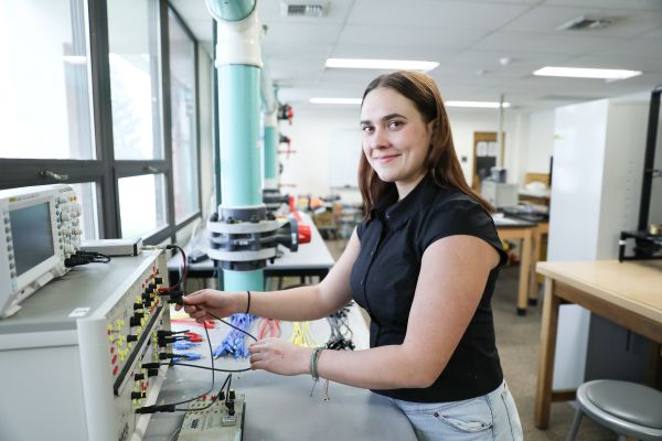 !Natalka Rolfson poses for a photo in the electrical engineering lab