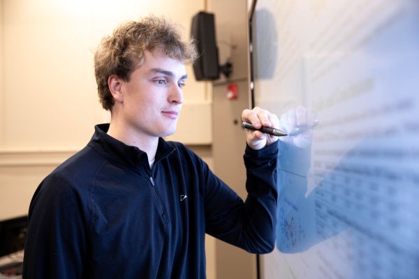 Adam at the whiteboard