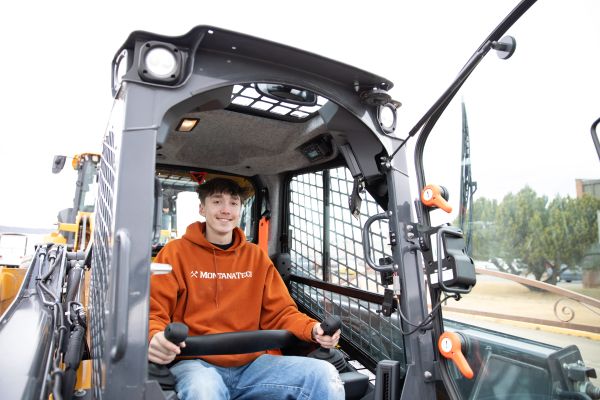 !A student drives a skidsteer