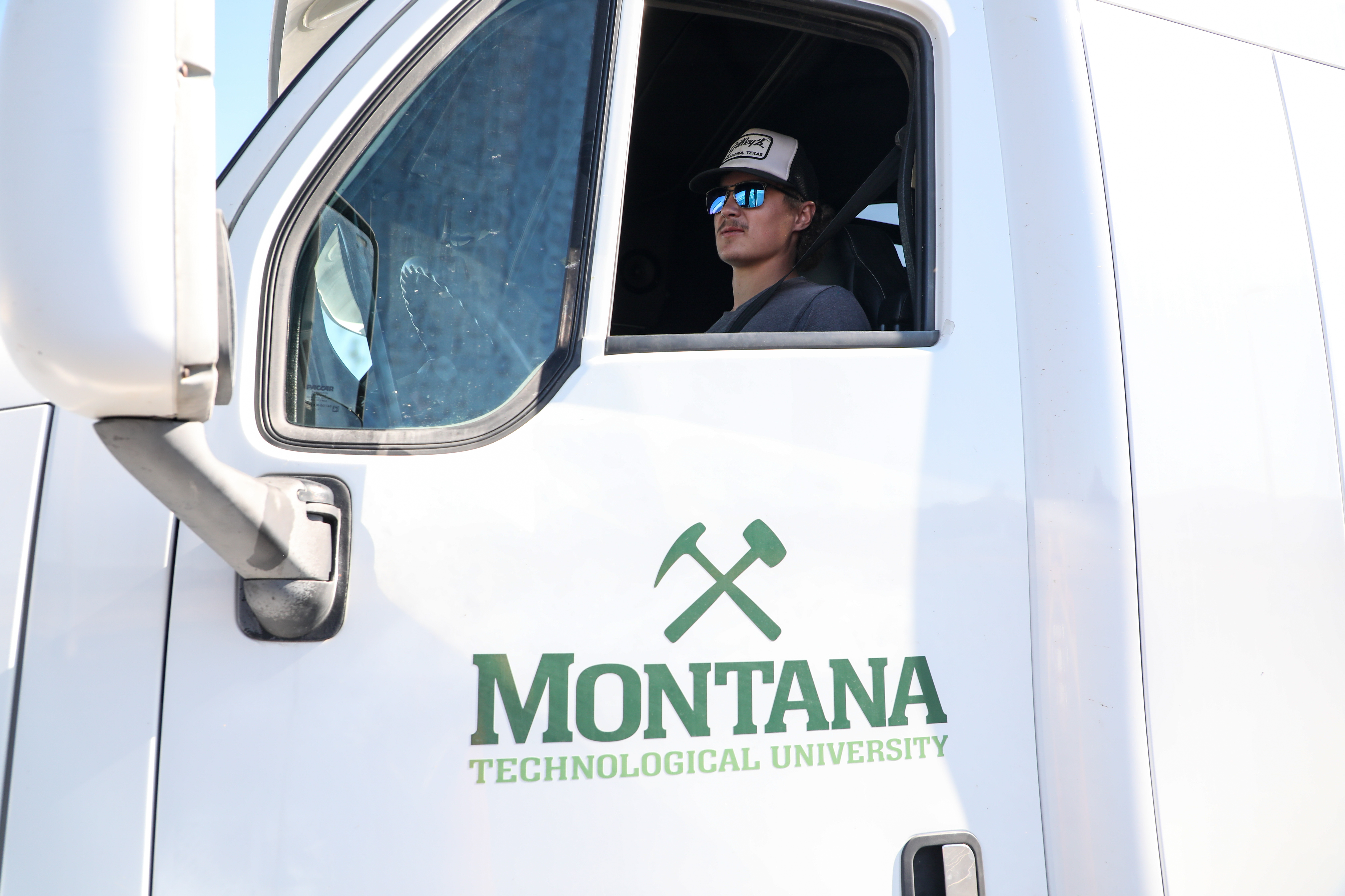 !A student in the cab of a commercial vehicle