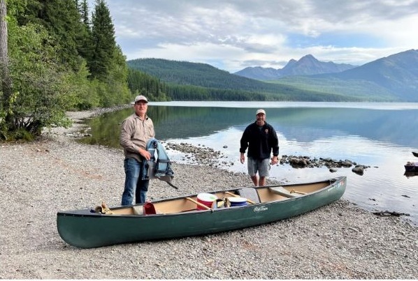 Two team members with a canoe at Kintla lake