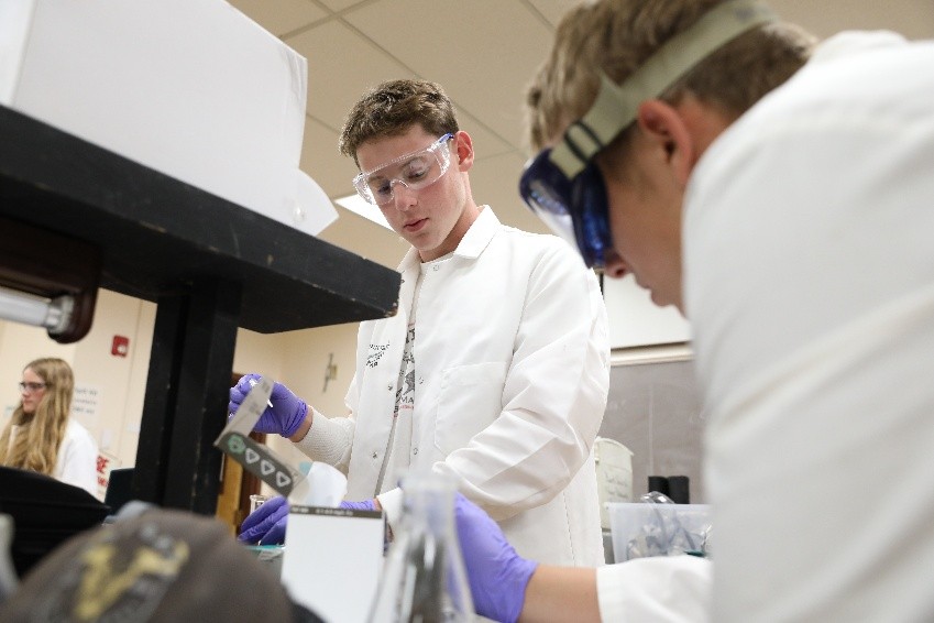 !Campers test water-treatment prototypes in the lab as part of the Emergency at Granite Pass design challenge.