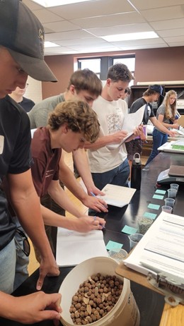 Campers work through their design challenge prototypes in the lab.
