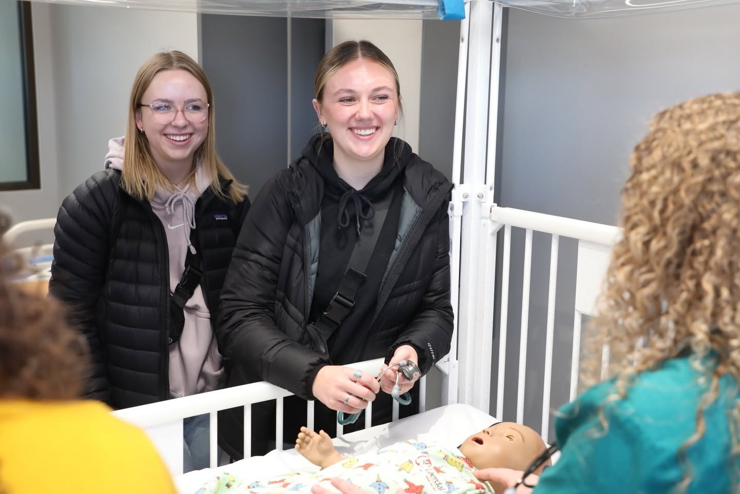 Students work with mannequins