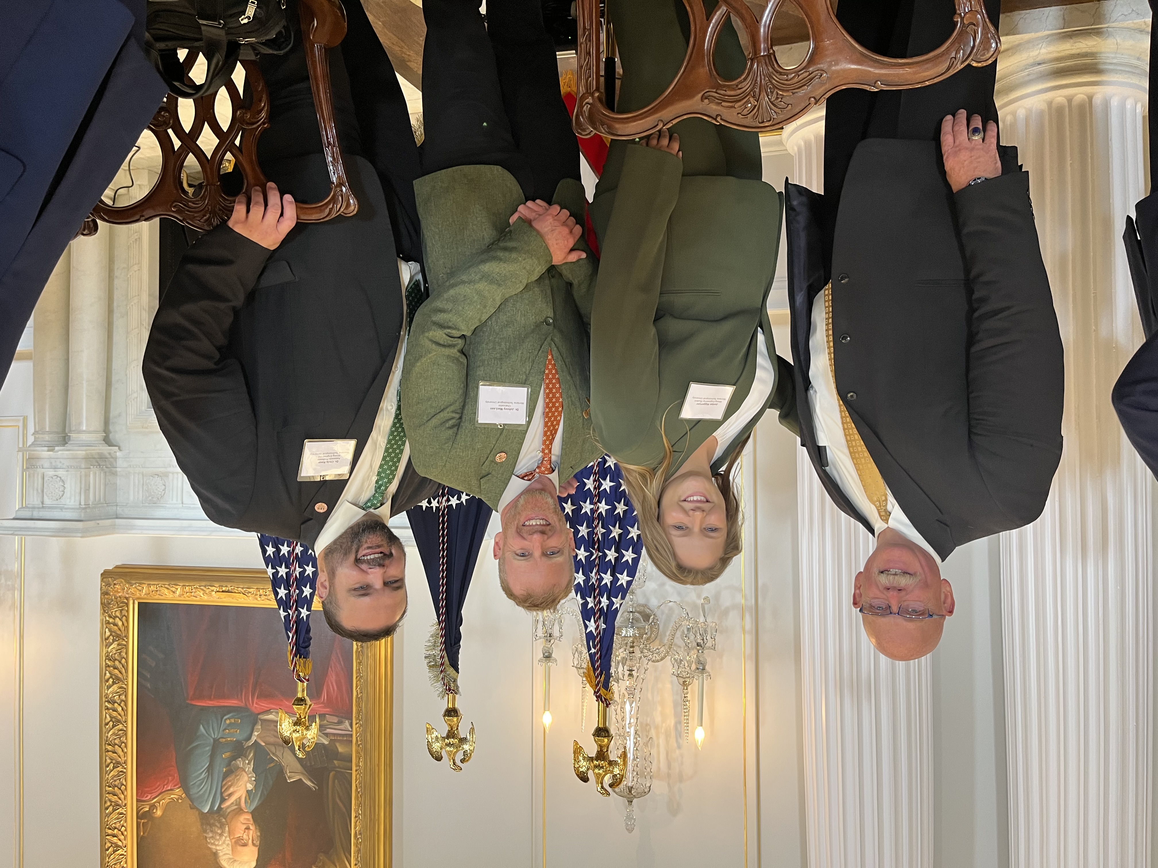 !University representers standing at the white house