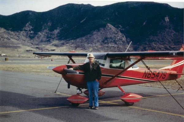 Professor Hugh Dresser stands in front of a plane