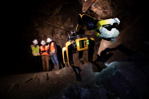 Spot, a Boston Dynamics robot, working in the UMEC with three students