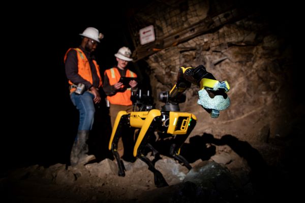 Students work with a mining robot