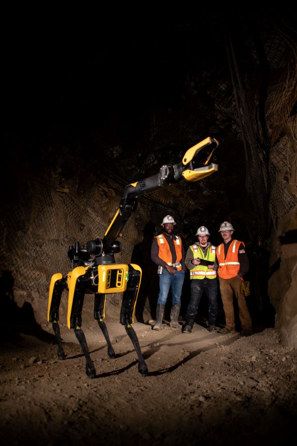 Spot, a Boston Dynamics robot, working in the UMEC with three students